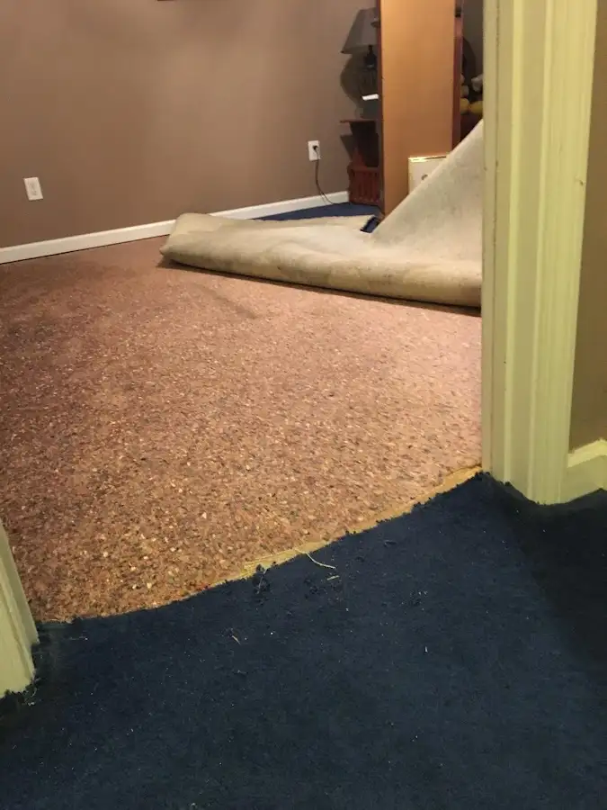 Carpet pad removal revealing water damage during Drying & Dehumidification in Makakilo