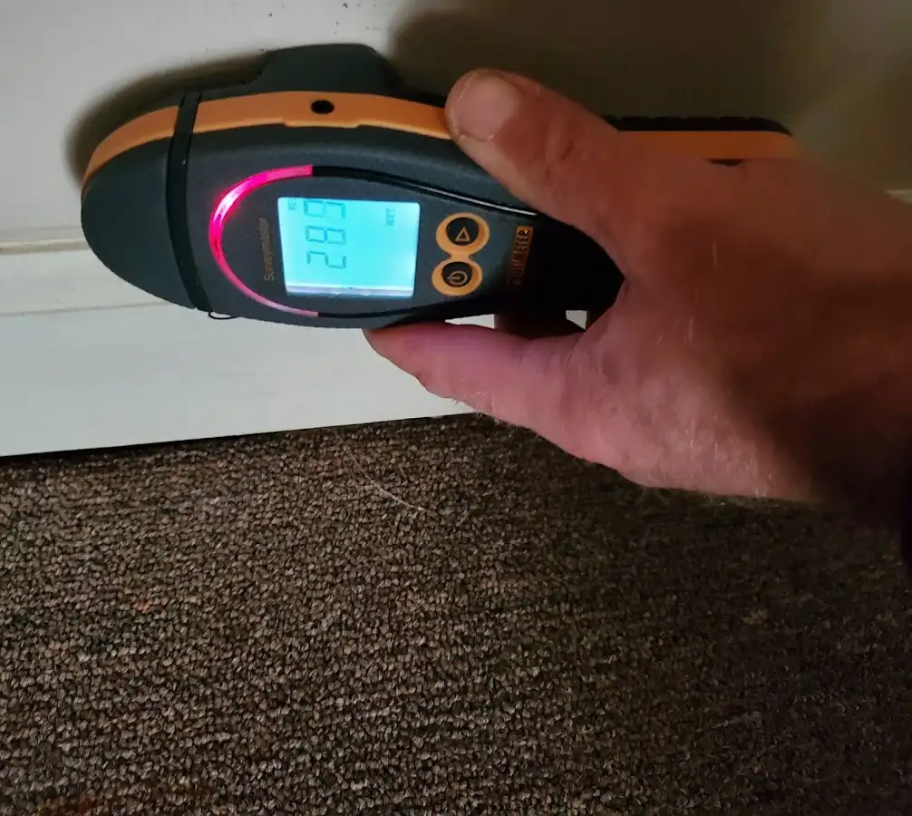 Moisture detection at baseboard during Storm Damage Restoration in Makakilo